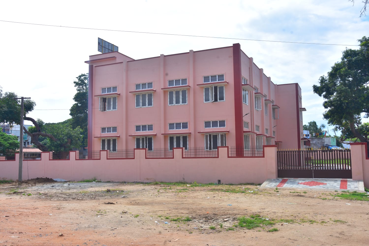 Rear elevation of the three-storey kalyana mandapam with boundary wall and gates