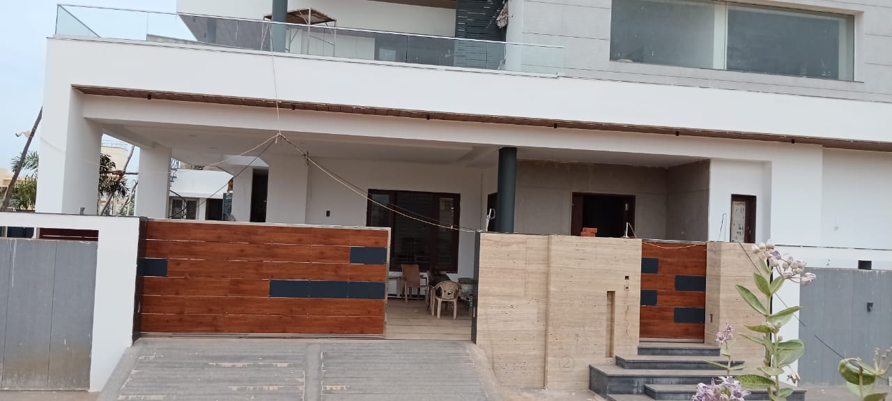 Completed modern two-storey residence with wooden entry gates