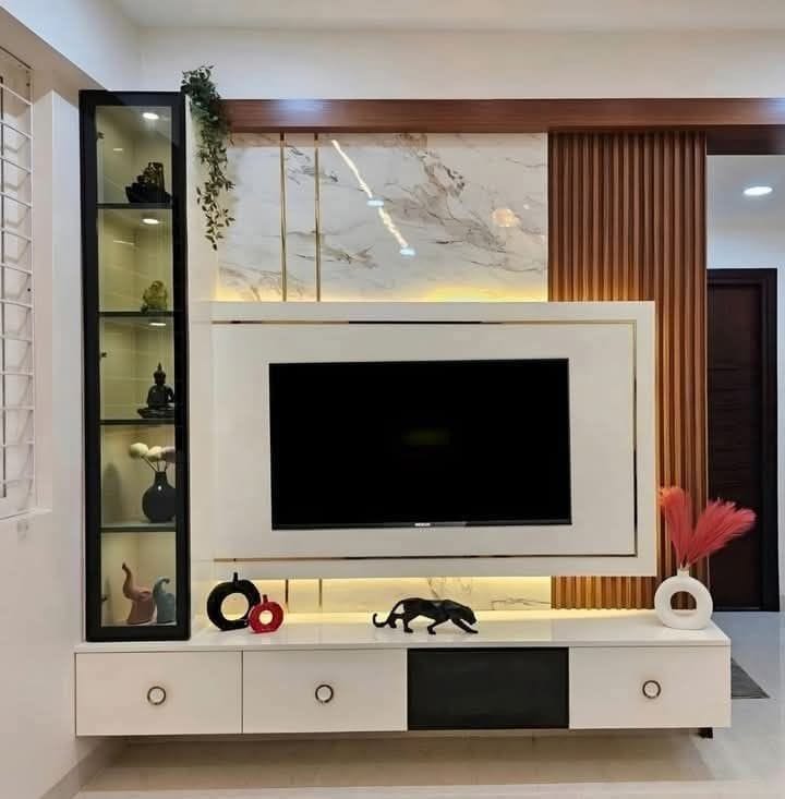TV console with onyx marble, glass display cabinet, and decorative styling