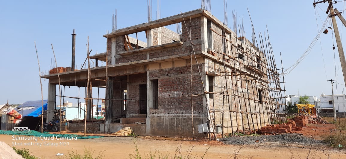 Reinforced concrete frame of a two-storey building with scaffolding