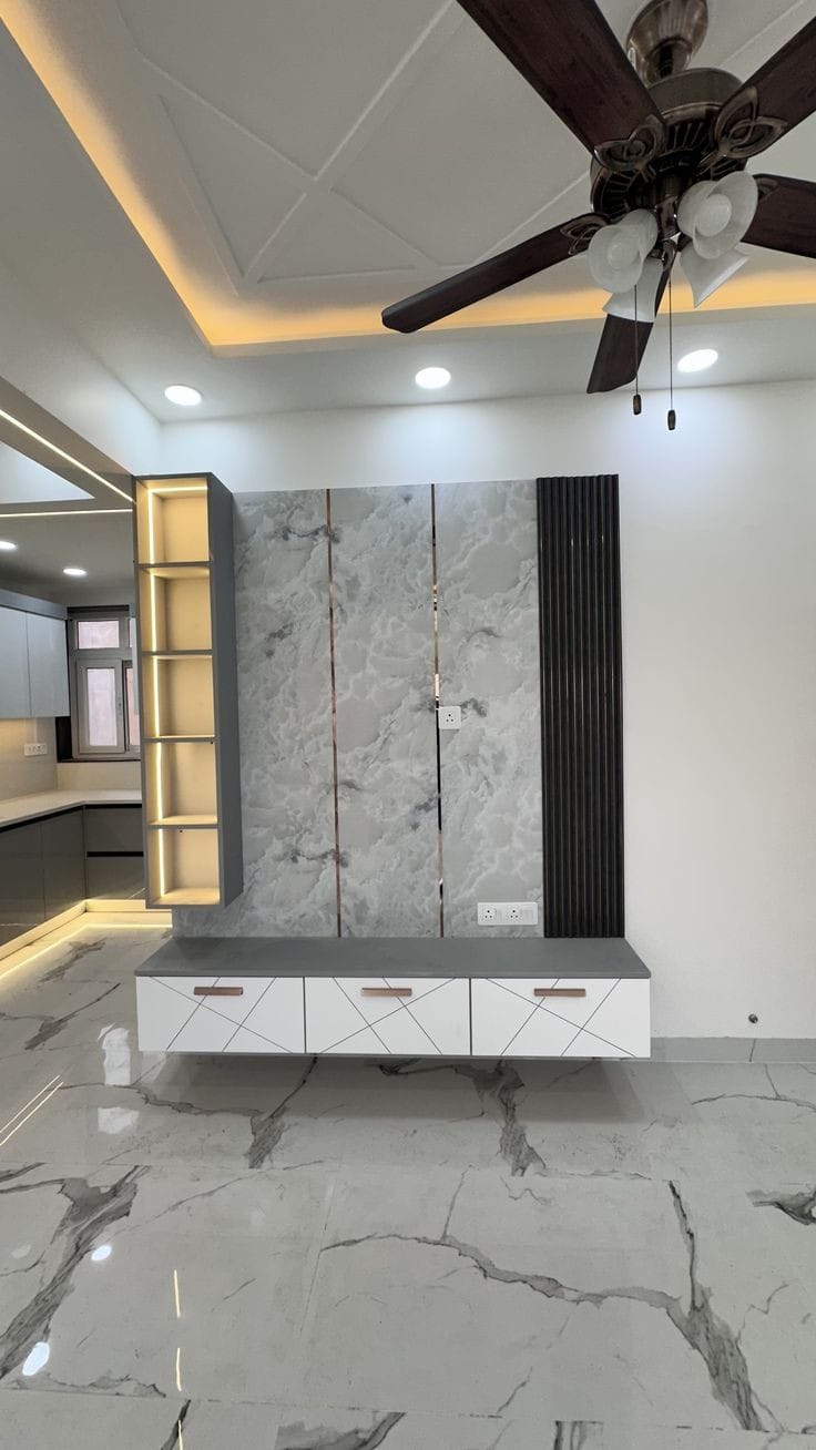 Statement marble feature wall with brass inlay and geometric floating console
